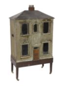 'Dunster House': A back-opening furnished dolls’ house, mid 19th century, set on its original