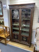 A 19th century French brass inlaid rosewood bookcase, width 124cm, height 216cm