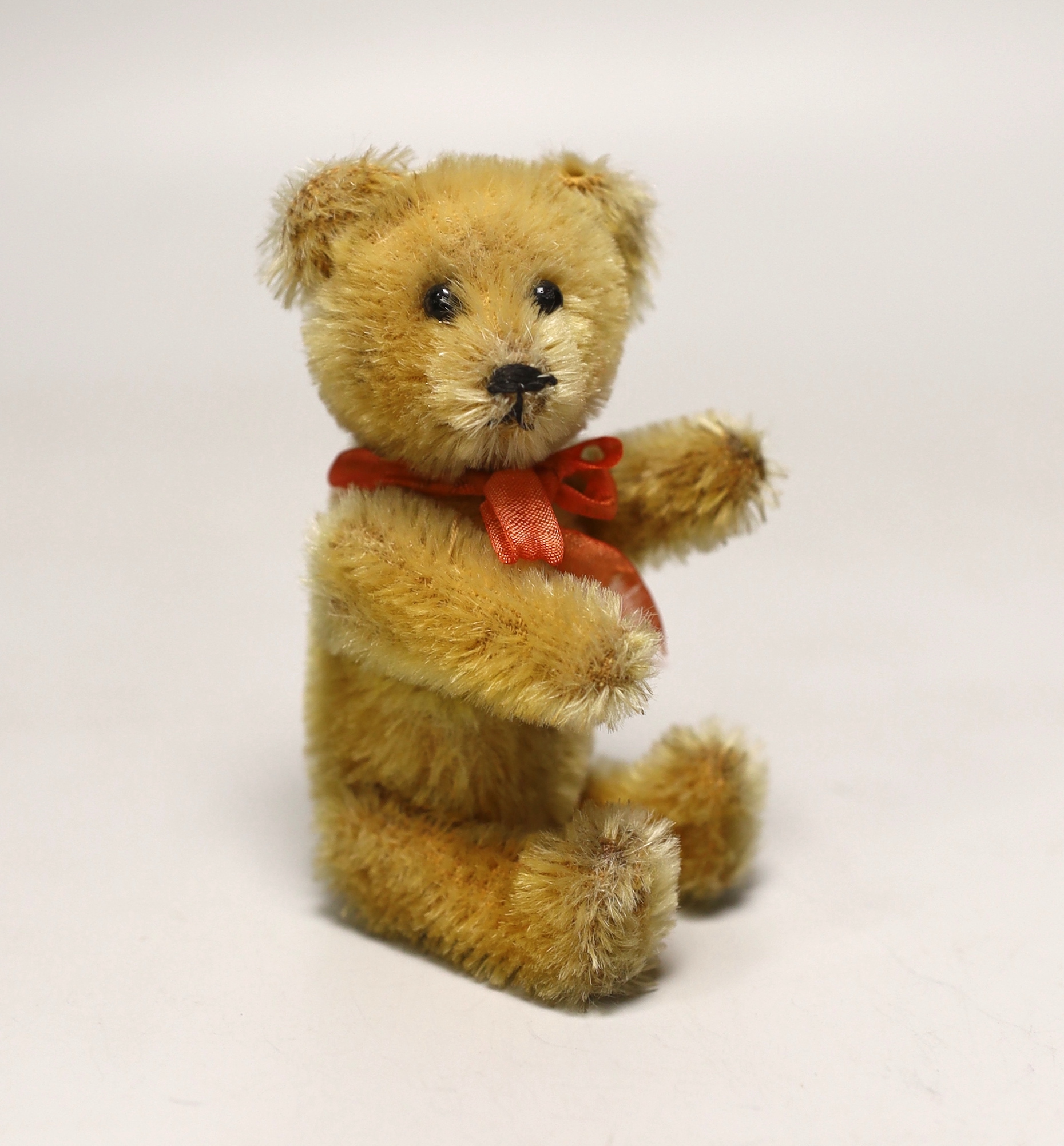 A Schuco perfume bear, 1950's, 5in., excellent condition, bottle complete