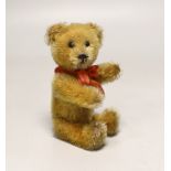 A Schuco perfume bear, 1950's, 5in., excellent condition, bottle complete