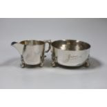 An Edwardian silver cream jug and sugar bowl, on ball feet, by William Comyns, London, 1907, bowl