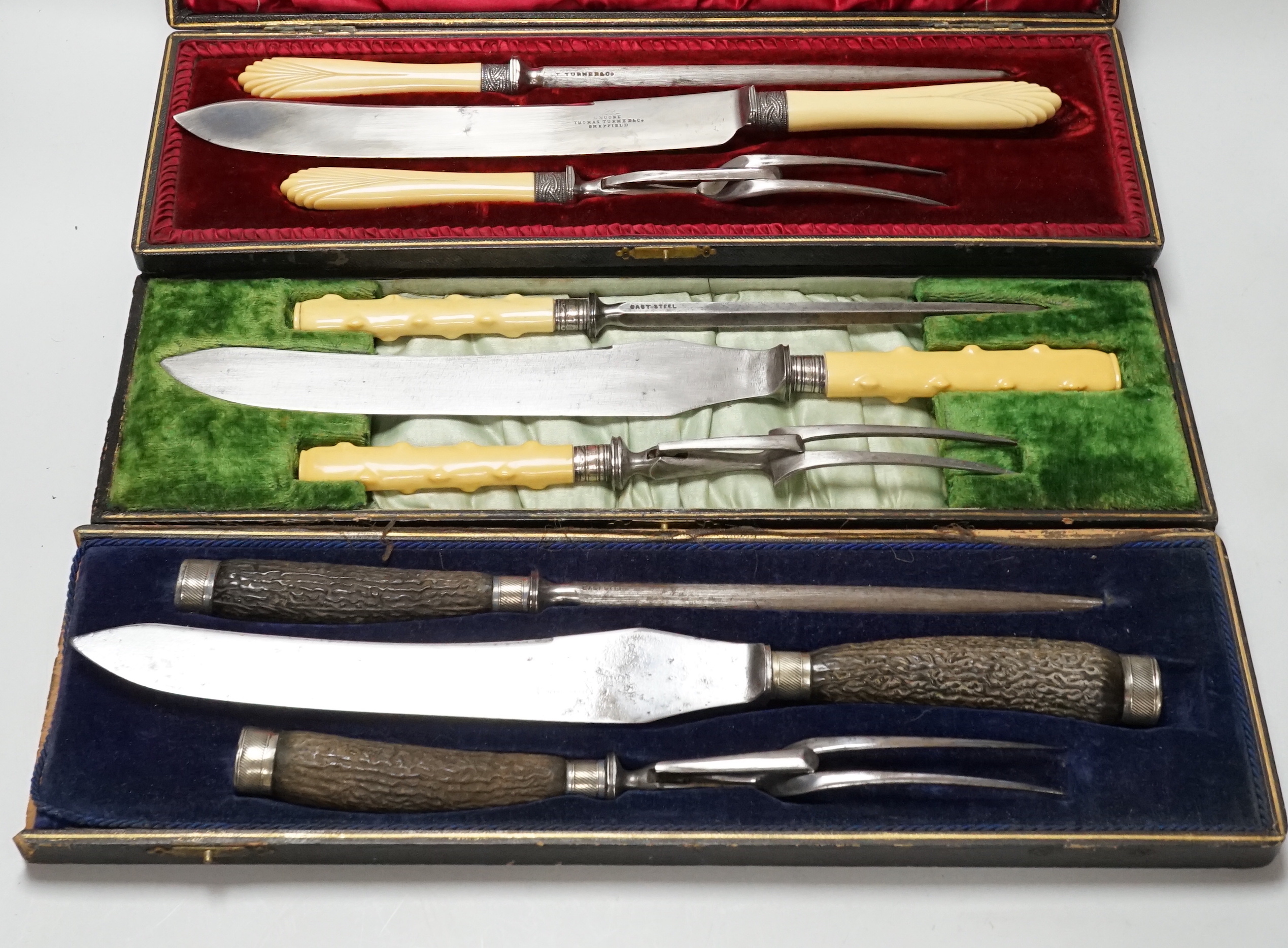 Three Victorian cased carving sets, including one with silver mounts