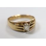 A late Victorian 15ct gold and claw set solitaire diamond ring, size Q, gross weight 5.5 grams.