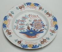 An 18th century English delftware polychrome charger, 31cm