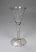 A George II drawn trumpet wine glass, folded foot, 18cm tall