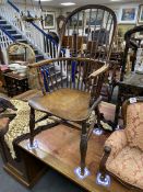 An early 19th century Windsor elm and beech comb back armchair, width 51cm, depth 49cm, height