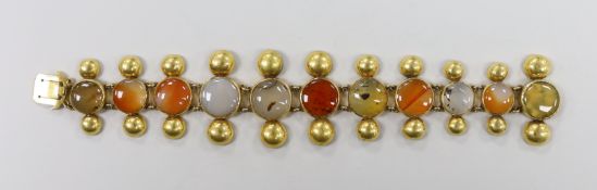 A Victorian pinchbeck and graduated eleven stone cabochon agate set bracelet, 18.5cm.