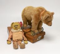 A Steiff bear on wheels, glass eyes, with original collar, no button, c.1920, height to shoulder