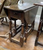 A Charles II and later oak small oval gateleg table, with a drawer, square and column turned legs