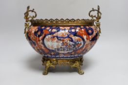An Imari planter with ornate brass mounts and handles, 24cm high base to top of handles