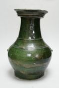 A Chinese Han dynasty dark green glazed ribbed baluster vase, hu, 34cm