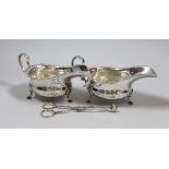 A pair of Edwardian silver sauceboats, Martin, Hall & Co, Sheffield, 1908 and a pair of 19th century