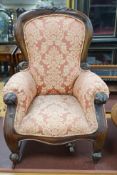 A Victorian style mahogany miniature upholstered elbow armchair, height 52cm
