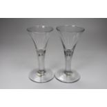 Two George II drawn trumpet wine glasses, each with air-tear, tallest 16cm