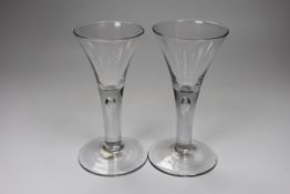 Two George II drawn trumpet wine glasses, each with air-tear, tallest 16cm