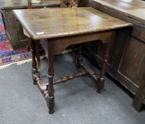 A late 17th century William and Mary small rectangular oak centre table, with arched apron, on