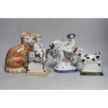 A Rye pottery Billy the goat, a boy riding a donkey, a lady on horseback and a cat, 20cm high (4)