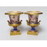 A pair of Minton twin handled urn form vases, hand painted with floral motifs, in the style of