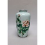 A Japanese cloisonné enamel vase decorated with roses upon a pale blue ground, silvered rim and