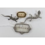 A 1920's French white metal and paste set etched glass brooch, 53mm, two marcasite lizard brooches