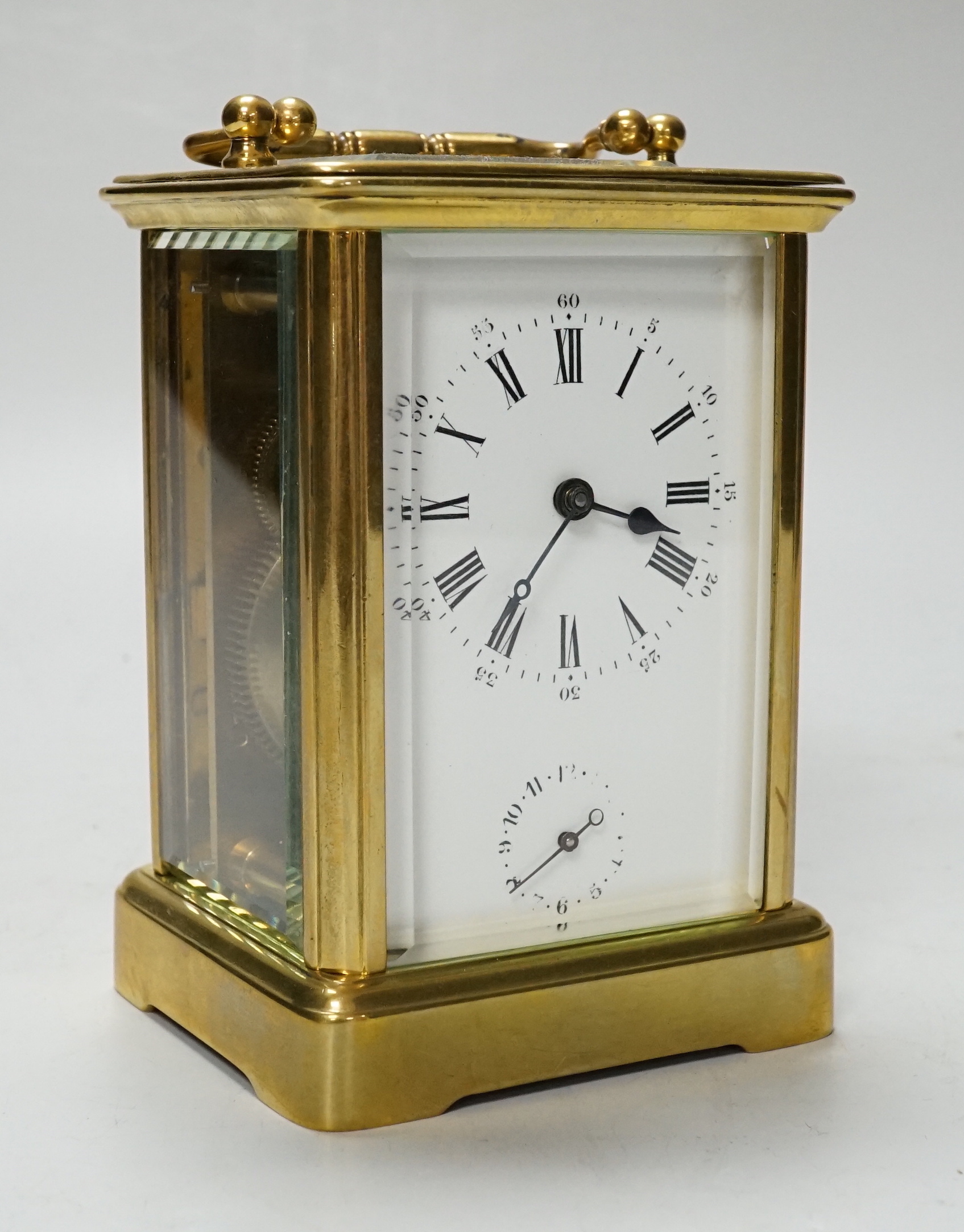 A cased carriage timepiece with alarm