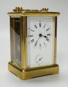 A cased carriage timepiece with alarm