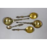 Two Victorian parcel gilt silver apostle spoons, London, 1879 and 1882, 20.2cm, 4.5oz and three