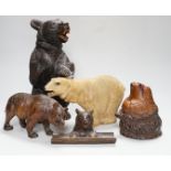 A group of Black Forest wooden carved bears, one standing 13in., with a barometer, 8in., and