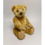 A Deans 1950's mouse eared bear, label on left foot, 16in., repair to paw pads, good mohair