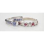 A modern continental white metal ruby and diamond set half hoop ring (ruby missing), size P and