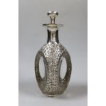 An early 20th century Chinese white metal mounted glass Haig decanter and stopper, Hong Kong, height