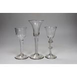 Three George II air twist stem wine or cordial glasses, tallest 17.5 cm high