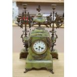 A French green onyx and bronze clock garniture, early 20th century, clock 50cm high
