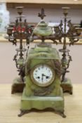 A French green onyx and bronze clock garniture, early 20th century, clock 50cm high