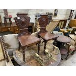 A pair of Victorian mahogany hall chairs, width 44cm, height 91cm