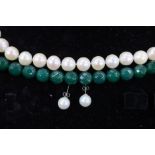 A modern Middle Eastern single strand cultured pearl necklace, with white metal clasp, 42cm, a