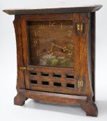 An American oak Arts and Crafts mantel clock, 35cm tall