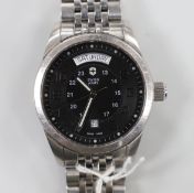A gentleman's modern stainless steel Swiss Army day/date automatic wrist watch, on a stainless steel