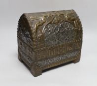 An early 20th century hammered pewter and brass neo-gothic casket, with poker work and velvet