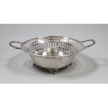 A George V pierced silver two handled bowl, William Hutton & Sons, Sheffield, 1927, 25.2 cm over