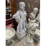 A reconstituted stone garden statue of a lady carrying fruit baskets, height 140cm