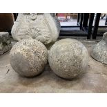 Two stone decorative garden balls, height 20cm