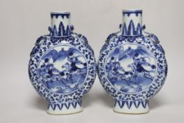 A pair of 19th century Chinese blue and white moonflasks, 26cm high