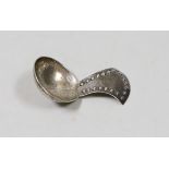 A George V Arts & Crafts silver caddy spoon, by the Keswick Scholl of Industrial Art, with beaded
