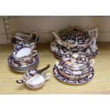 A mid 19th century Derby Imari pattern tea service, comprising a pair of two handled cake plates,