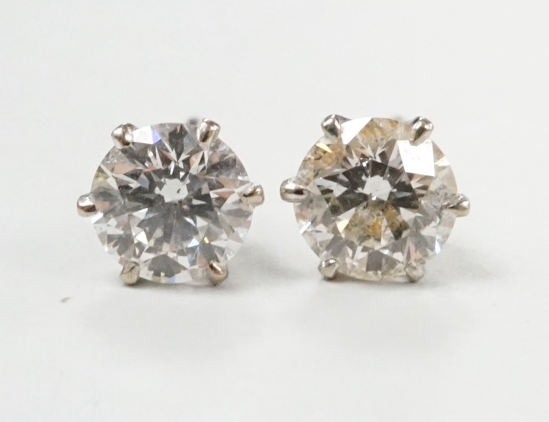 A pair of white metal and solitaire diamond set ear studs, each stone measuring approx. 5.2mm in