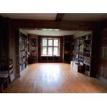 Three dismantled oak bookcases, formerly in the library at Plumpton Place, consisting of an ‘’L’’