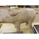 A large carved painted wooden pig, 78cm long
