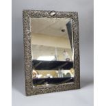 A late Victorian repousse silver mounted rectangular easel mirror, Henry Matthews, Birmingham, 1896,