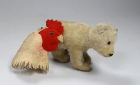A Steiff hen egg cosy, c.1910, with button, 3in., and a 1950's Polar bear, button, good condition